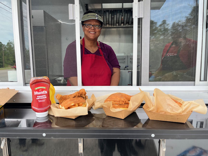 hot-mama-at-the-window Hot Mama's Kitchen Soul Food, Food Truck, Event catering in Hampton Roads
